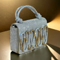 VELMA’S MILLINERY SILVER BAG